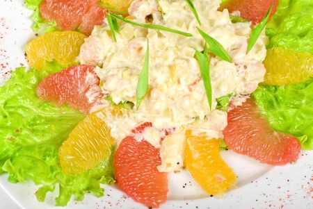 seafood salad of shrimp baked at cream with orange and grapefruit isolated on a white backgroundの写真素材