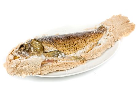Fish, carp baked with dough isolated on whiteの写真素材
