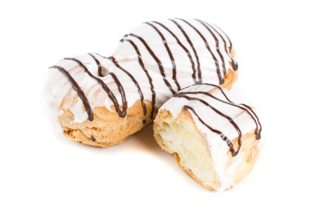 Cream eclairs isolated on a white background