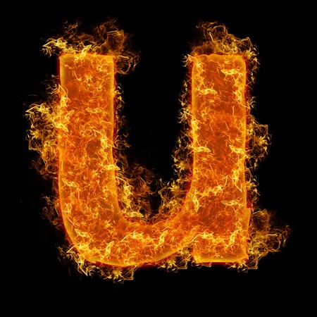 Fire small letter U on a black backgroundの写真素材