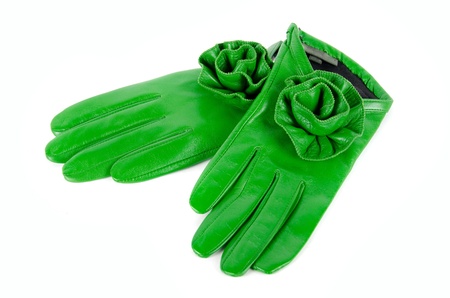 green modern female leather rose gloves isolated on a whiteの写真素材