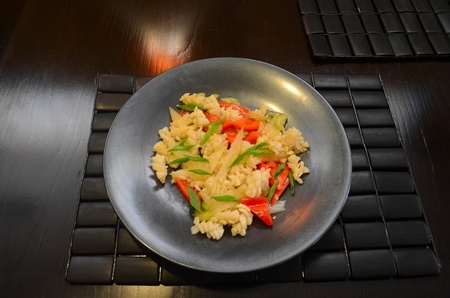 closeup dish of calamari with celery at black plateの写真素材
