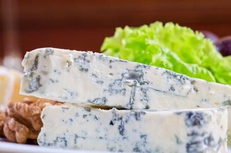 Blue cheese with lettuce, grapes and nuts closeupの写真素材