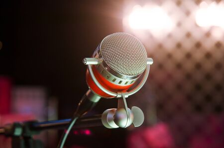 Closeup of audio microphone on stage backgroundの写真素材