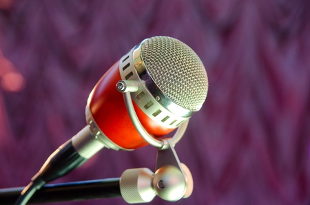 Closeup of audio microphone on stage backgroundの写真素材