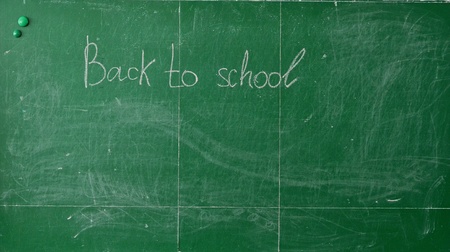 Green chalk blackboard written Back To School with white chalkの写真素材