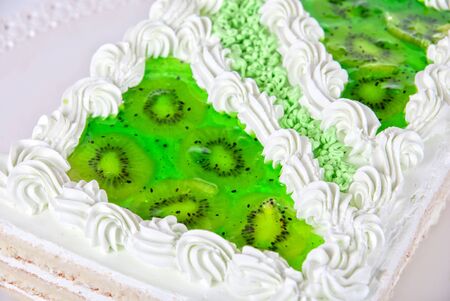 fruit kiwi cake closeup isolated on a whiteの写真素材