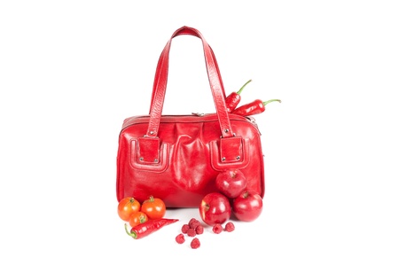 Modern fashion woman bag with fruit and vegetable on a whiteの写真素材