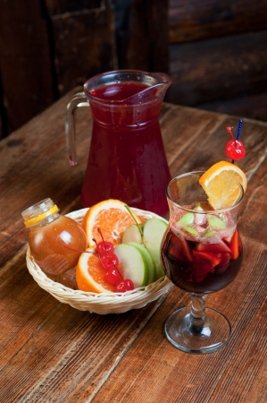 Mulled wine with oranges, apple, honey and berry の写真素材