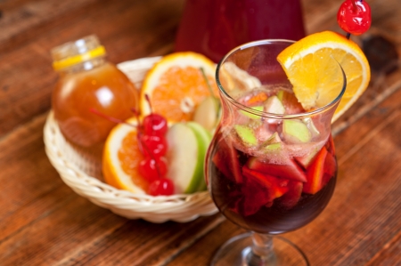 Mulled wine with oranges, apple, honey and berry の写真素材