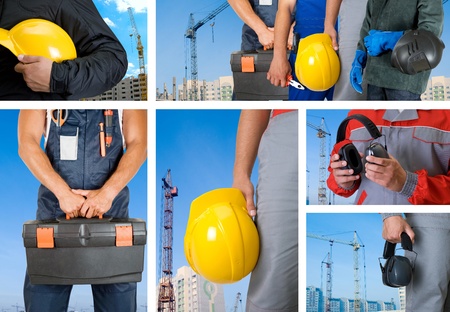 workers with equipment on building background setsの写真素材