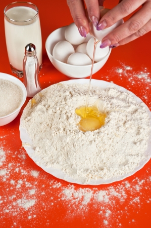 Baking ingredients  eggs, flour, sugar, salt and milkの写真素材