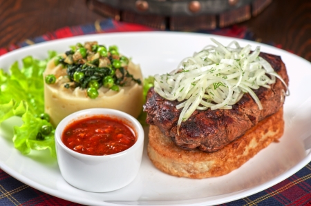 Gourmet steak meat with potato, vegetables and sauceの写真素材