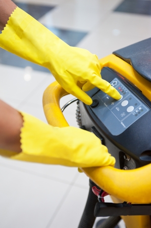 Cleaner workers with mop in uniform cleaning floorの写真素材