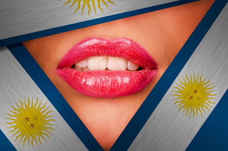 Beautiful female lips closeup behind argentina backgroundの写真素材
