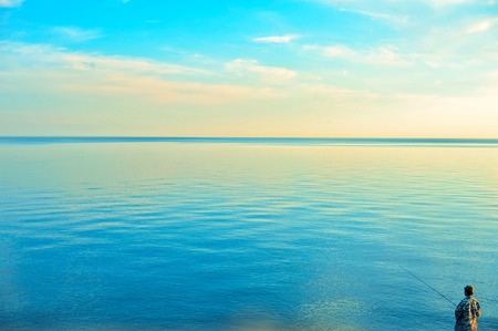 Fishing man at beauty sunriseの写真素材