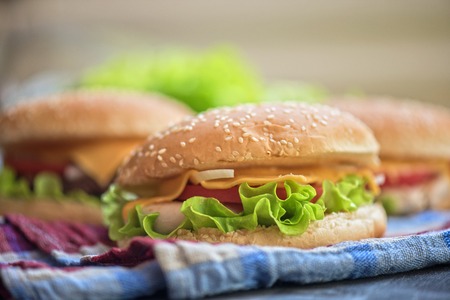 Closeup of home made burgers on wooden tableの写真素材