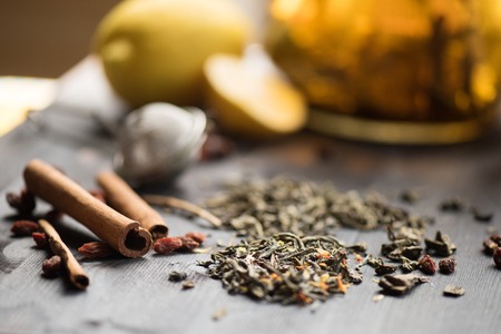 tea composition with cinnamon sticks, lemonsの写真素材