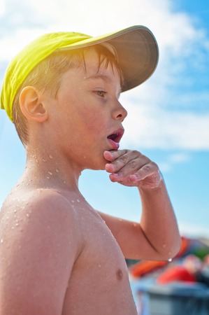 Baby boy at the beachの写真素材