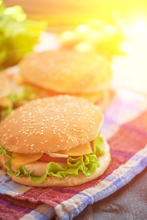 Closeup of home made burgers on wooden tableの写真素材