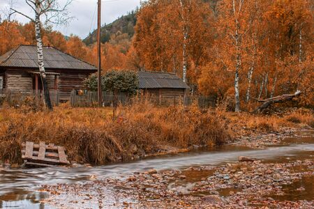Autumn at mountain village with riverの写真素材