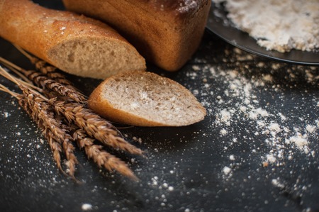 Bread composition with wheats. Very shallow DOF photo and specific art curly bokeh for extra volume.の写真素材