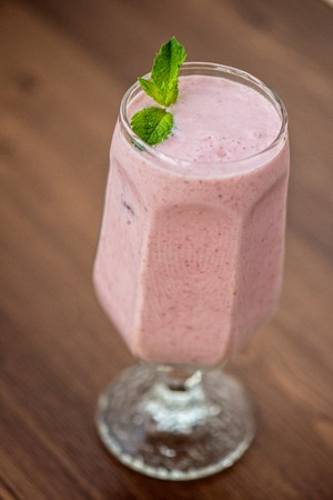 Strawberry smoothie on the tableの写真素材