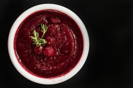 Refreshing cranberry sorbet at white bowlの写真素材