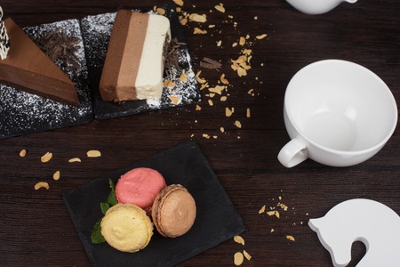 Table with cakes ans coffee cup