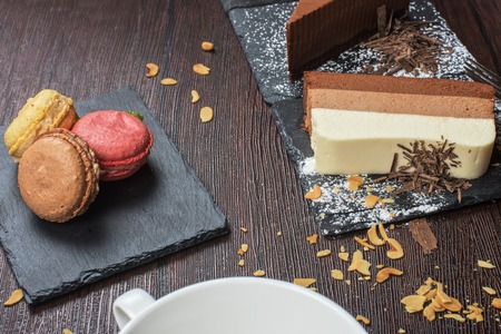 Table with cakes ans coffee cupの写真素材