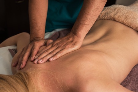Woman having a massage at spaの写真素材