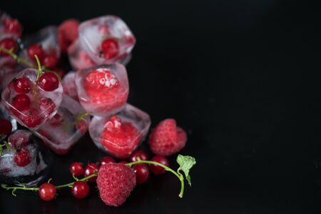 Fresh frozen berries raspberry and red currantの写真素材