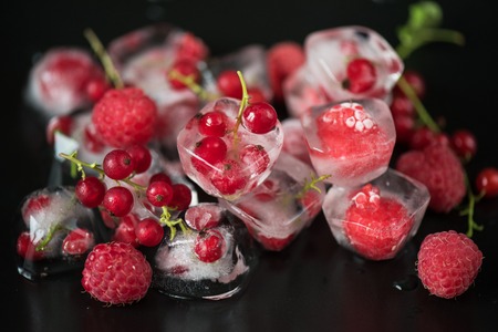 Fresh frozen berries raspberry and red currantの写真素材
