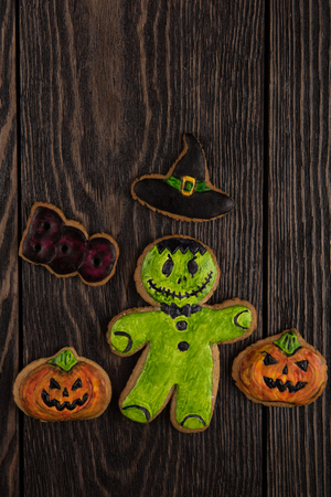 Homemade delicious ginger biscuits for Halloween on wooden tableの写真素材