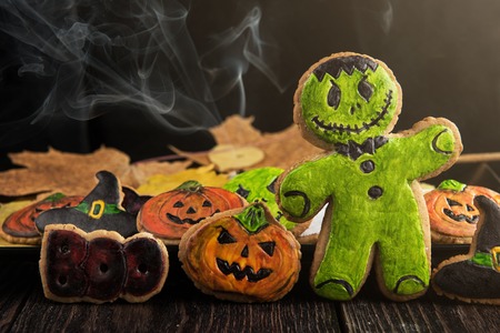 Homemade delicious ginger biscuits for Halloween on wooden tableの写真素材