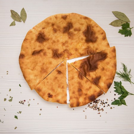 Ossetian baked pie with cheese and salmon fishの写真素材