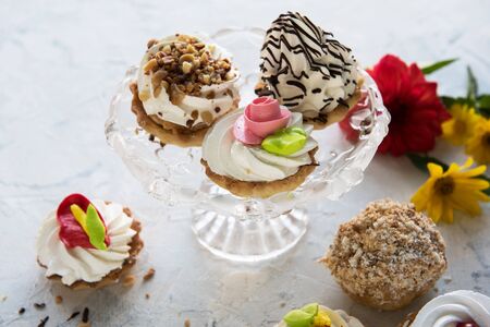 Different cakes composition on concrete background
