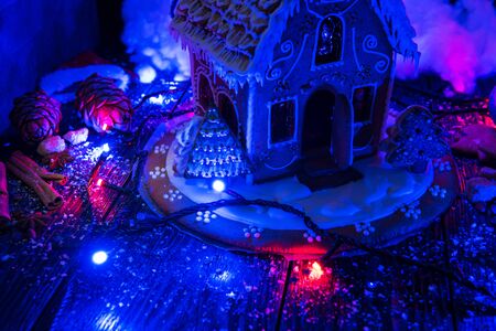 Homemade gingerbreads for new year holiday on dark wooden background, xmas themeの写真素材