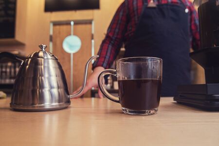 Barista brewing aeropress coffeeの写真素材