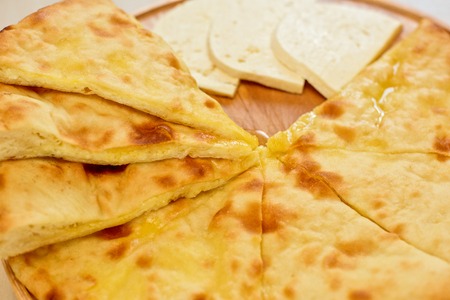 ossetian pie with cheese on a white backgroundの写真素材