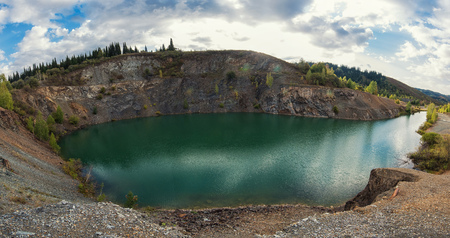 Blue lake in Altai. This is a former copper mine that was flooded with waterの写真素材