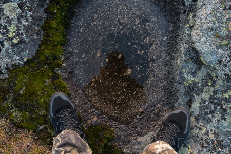 Man resting in the mountains, pov viewの写真素材