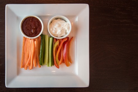 Fresh carrot cucumber pepper and two sauce. Healthy food. Low-Carb Diet. Vegetarian food.