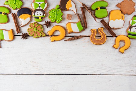 Gingerbreads cookies for Patricks day on white wooden backgroundの写真素材