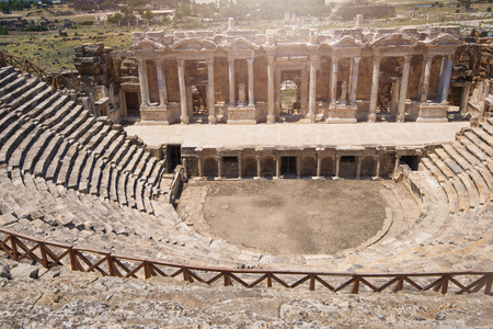 Roman amphitheatre in the ruins of Hierapolis, in Pamukkale, near modern turkey city Denizli,...