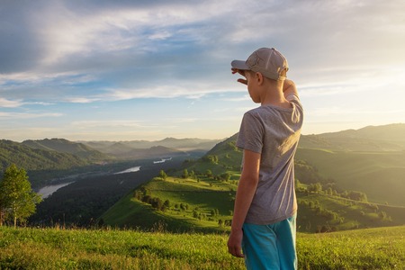 Young explorer at the sunset in Altai mountainsの写真素材