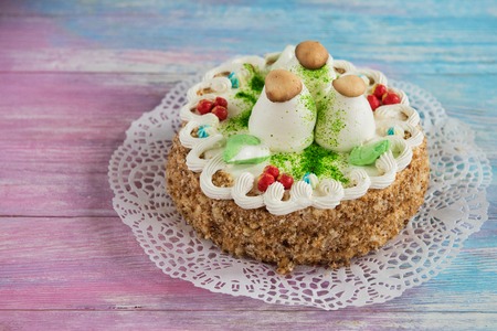 Tasty mini cake on a color gradient backgroundの写真素材