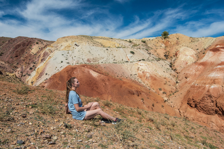 Woman in valley of Mars landscapes in the Altai Mountains, Kyzyl Chin, Siberia, Russiaの写真素材
