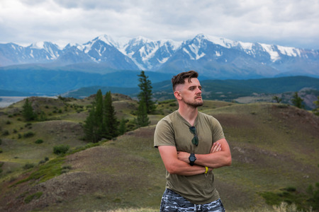 Relaxing man in Valley of Mars landscapes in the Altai Mountains, Kyzyl Chin, Siberia, Russiaの写真素材