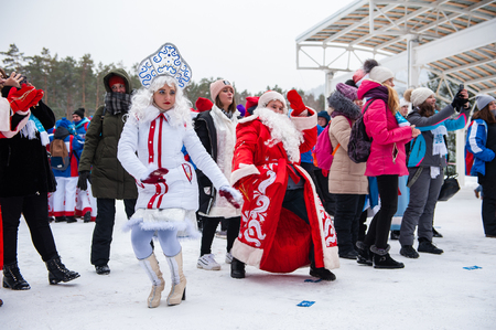 BYURIZOVAYA KATUN. ALTAISKIY KRAI. WESTERN SIBERIA. RUSSIA - DECEMBER 1, 2018: Father Frost and Snow Maiden on folk winter holiday called the Altaiskaya Zimovka holiday - the first day of winter on December 1, 2018 in Altayskiy krai, Siberia, Russia.のeditorial素材